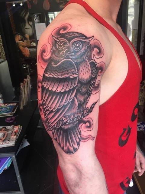 Owl arm tattoo